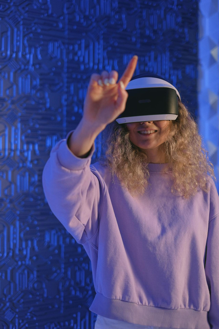 Woman in VR Glasses Touching Space