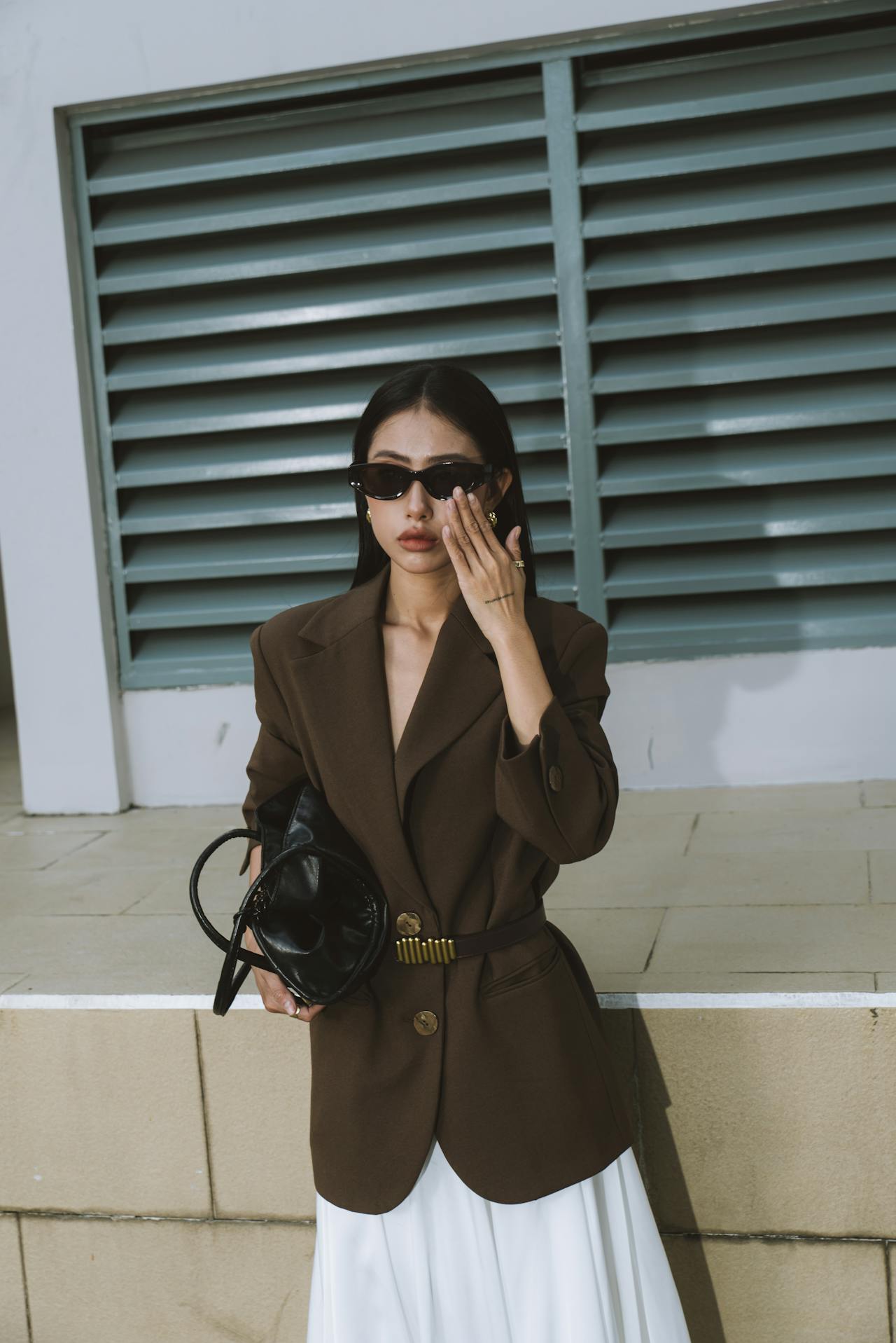 Stylish Woman in Brown Blazer and Sunglasses