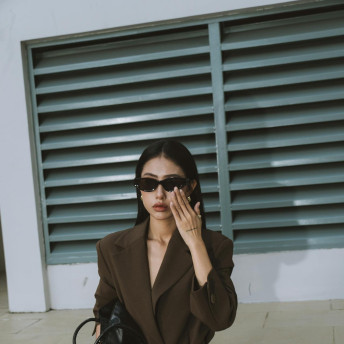 Stylish Woman in Brown Blazer and Sunglasses