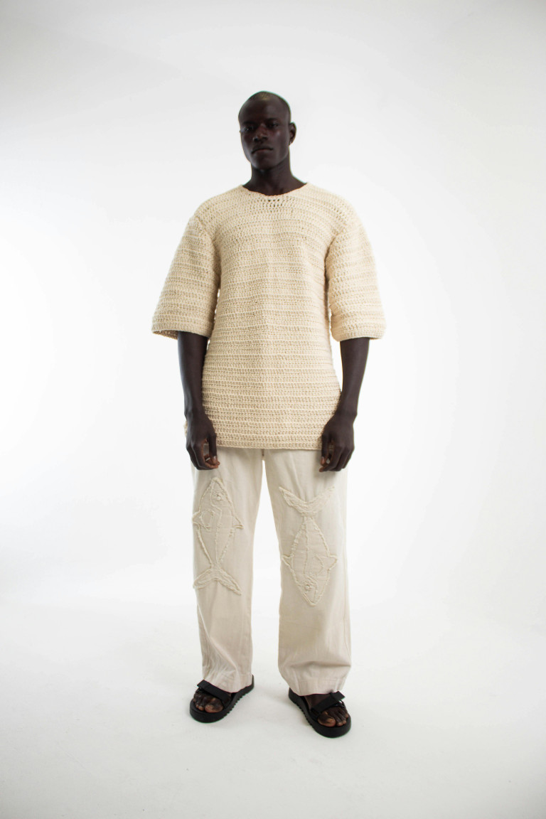 Stylish Black Man in Minimalist White Attire