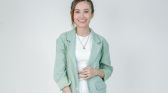 Fashionable Woman in Green Blazer Smiling