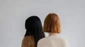 Women dressed in knitted sweaters and pants in studio
