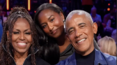 Michelle Obama with Barack and daughter Sasha.